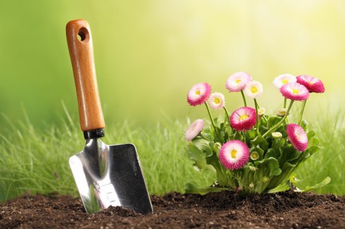 Finished outdoor living space in Goldersgreen with seasonal planting and structure
